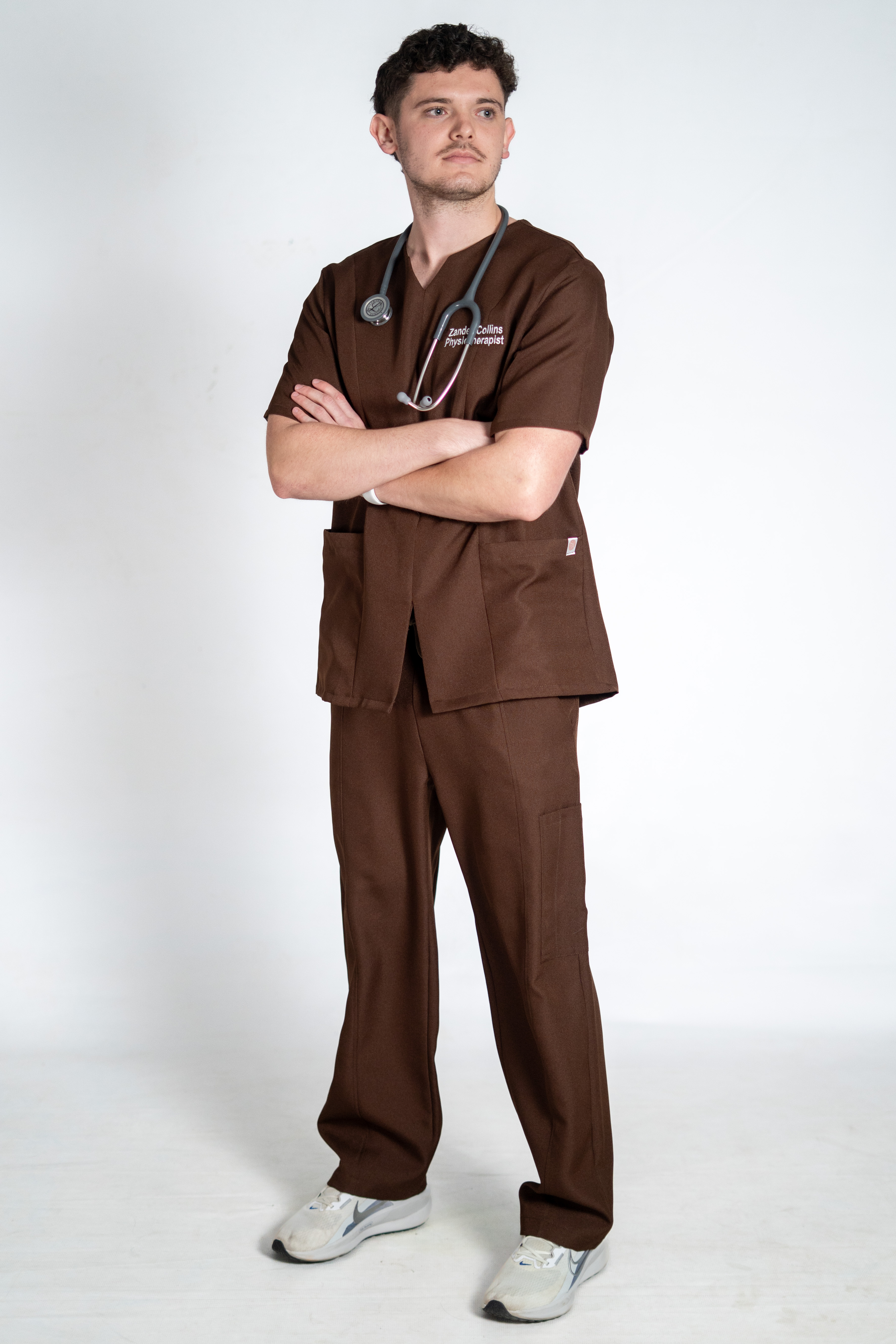 Team wearing Scrub Atelier stretch scrubs in a coordinated practice colour