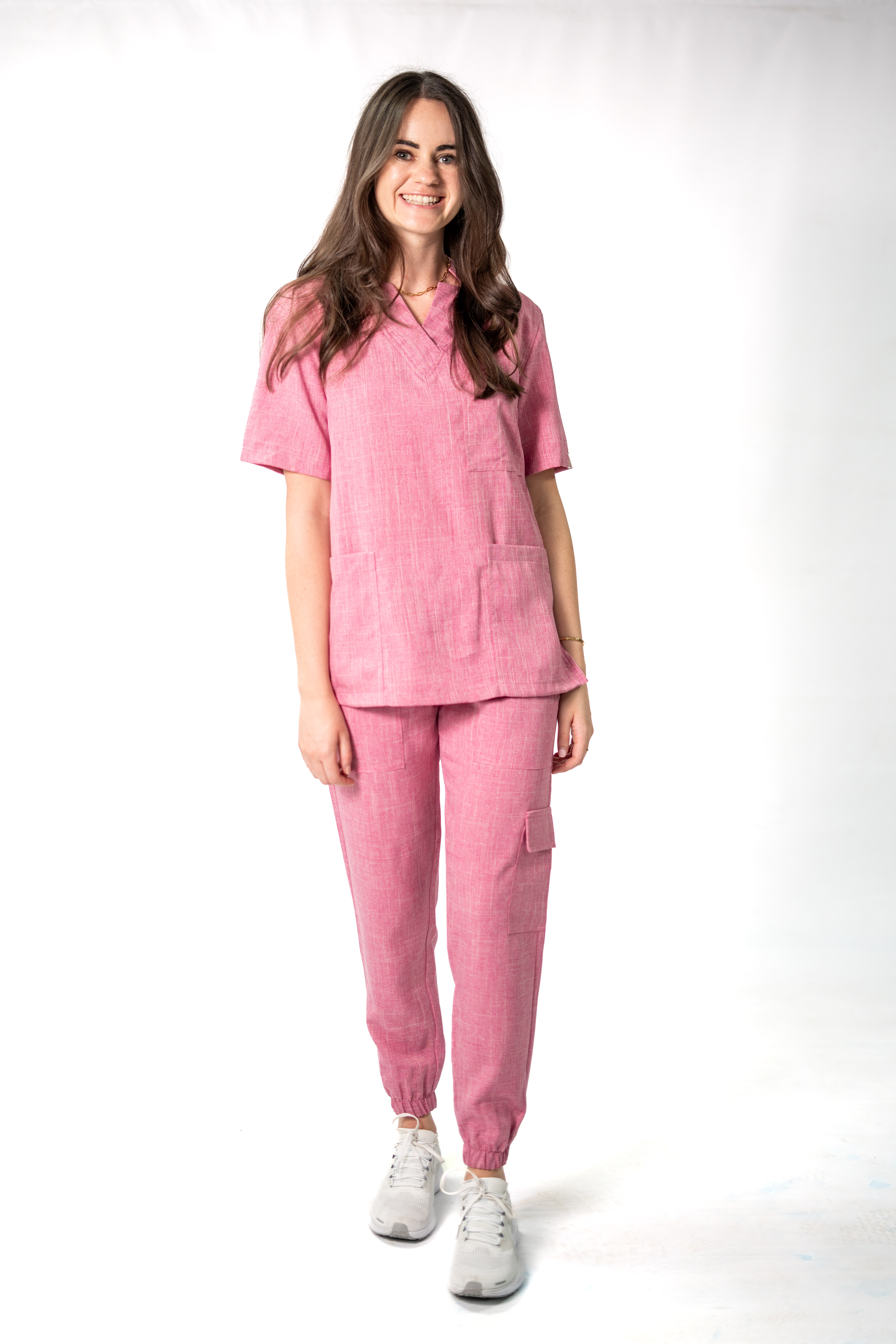 Linen team scrubs in natural grey worn by two healthcare professionals